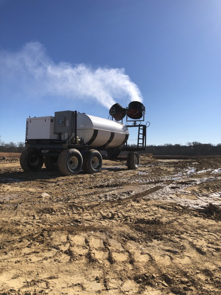 A portable spray-type mist system applies product over an active remediation site.