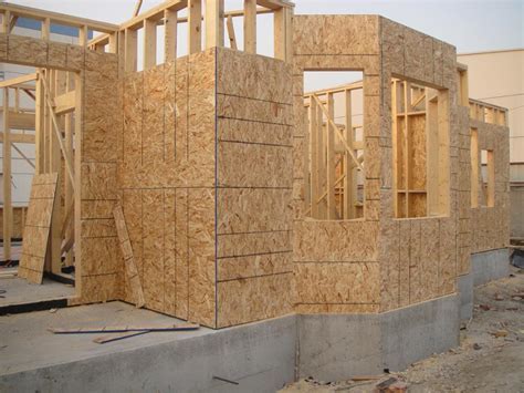 A construction project in progress showing oriented strand board sheathing.